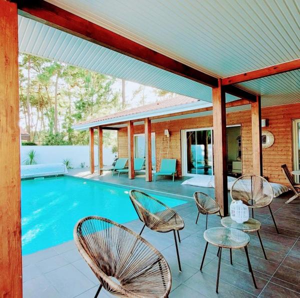 Villa_palms_mimizan_plage jolie villa 12 personnes, piscine chauffée et plage à pied, Book  Mimizan hoteller med parkering, Parkering